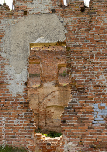 damaged red bricks from the wall of an ancient building