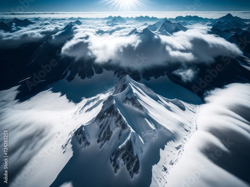 An aerial view of snow-covered mountains, showcasing their majestic peaks