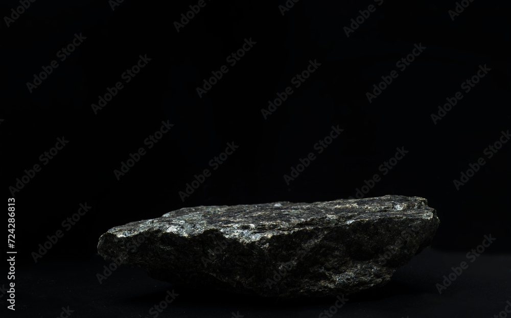 black stones with texture on a black background for the podium black stones with texture on a black background for the podium