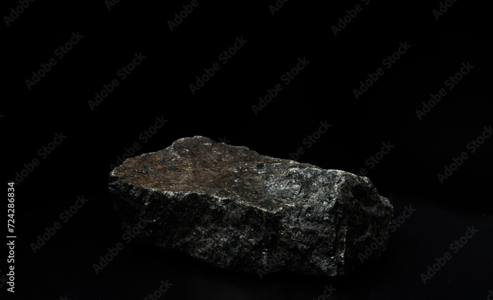 black stones with texture on a black background for the podium black stones with texture on a black background for the podium