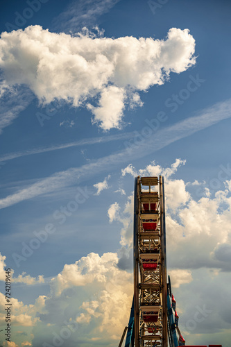 Serene Sky Above Ferris Wheel On a Clear Sunny Day