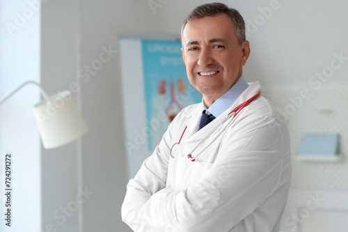 Mature doctor smiling in me...