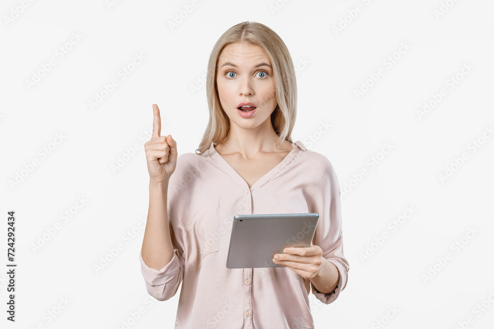 Young beautiful woman using tablet over white isolated background surprised with an idea pointing finger. Sale discount purchases online in shopping application Young beautiful woman using tablet over white isolated background surprised with an idea pointing finger. Sale discount purchases online in shopping application