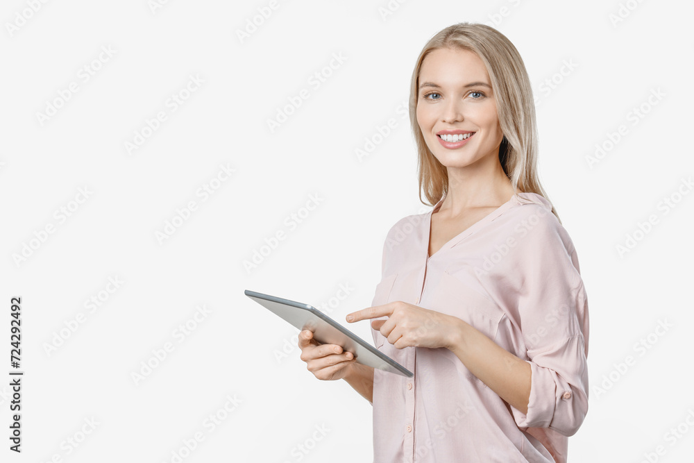 Cheerful young woman looking at camera using tablet computer over white background. Office worker freelancer influencer teacher typing on digital gadget remotely Cheerful young woman looking at camera using tablet computer over white background. Office worker freelancer influencer teacher typing on digital gadget remotely