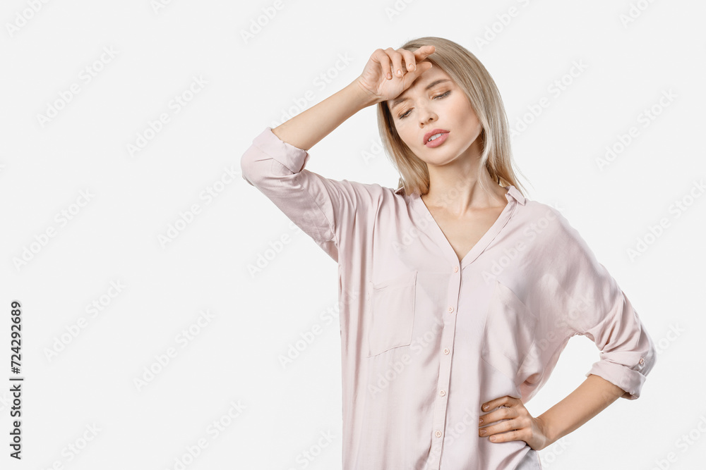 Young beautiful woman over isolated background getting tired. Exhausted fatigued pretty female after tedious hard working day night shift feeling ill sick Young beautiful woman over isolated background getting tired. Exhausted fatigued pretty female after tedious hard working day night shift feeling ill sick