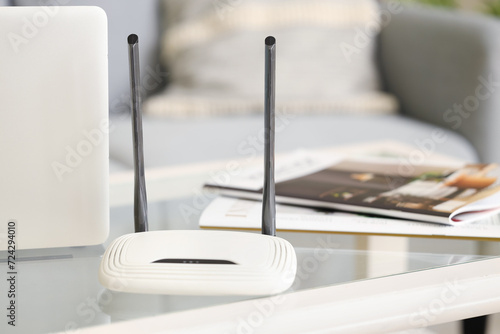 Modern wi-fi router on tabl...