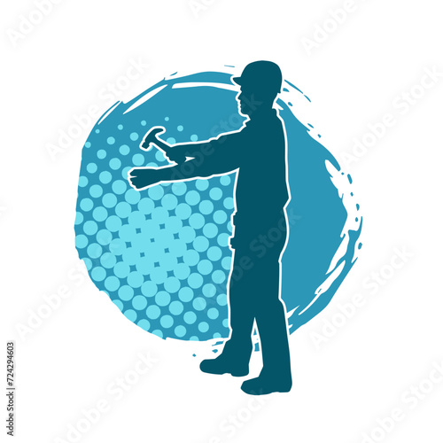 Silhouette of a worker carrying hammer tool. Silhouette of a worker in action pose using hammer tool.