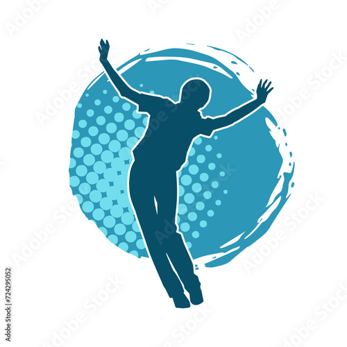 Silhouette of a slim female in dance pose. Silhouette of a woman dancing. photo