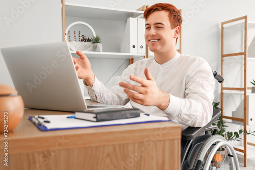 Smiling young man in wheelc...