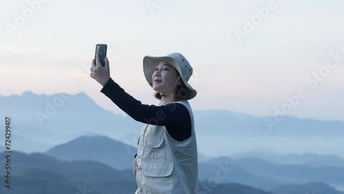 Happy young tourist women friends enjoy taking selfie together while travel in summer vacation trip on weekend, relaxing and using mobile phone photo