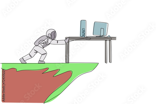 Single one line drawing angry astronaut shoves a desk containing a laptop and monitor over the edge of a cliff. Do not want to make an expedition report. Continuous line design graphic illustration