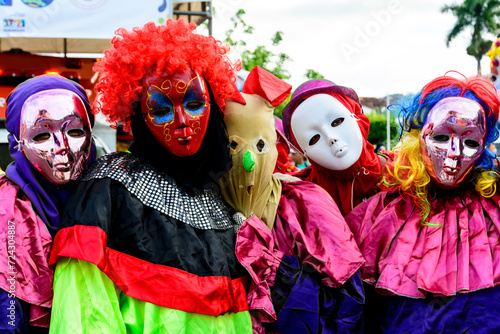 People wearing venice carnival costumes during festivities