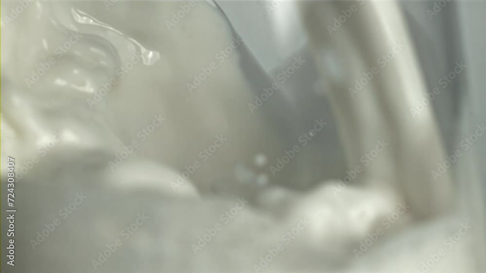 Splashes of milk in a glass. Macro shot. Filmed on a high-speed camera at 1000 fps. High quality FullHD footage Splashes of milk in a glass. Macro shot. Filmed on a high-speed camera at 1000 fps. High quality FullHD footage
