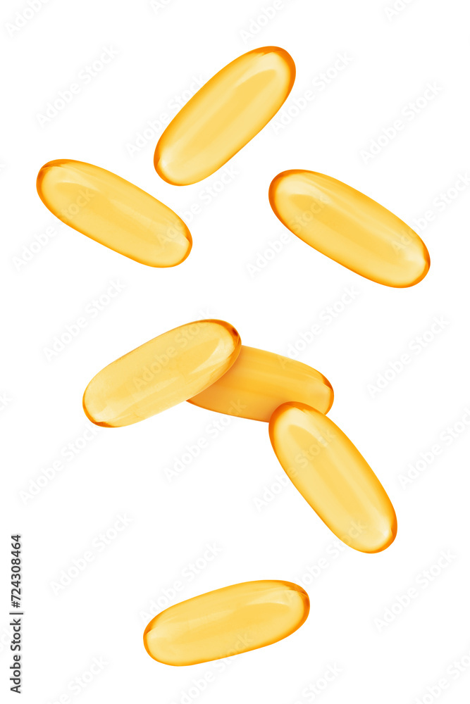 Vitamin. Softgel capsules falling on white background Vitamin. Softgel capsules falling on white background