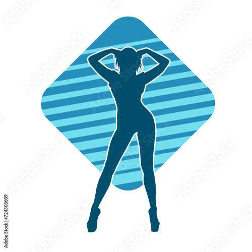 Silhouette of a slim female in dance pose. Silhouette of a woman dancing.