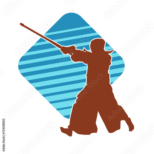 Silhouette of a sword warrior in action pose. Silhouette of a martial art person carrying sword weapon. Silhouette of kendo martial art pose.
