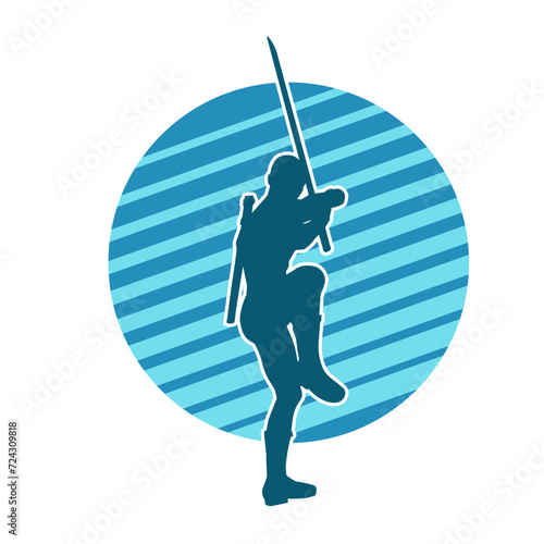 Silhouette of a male warrior in action pose with sword weapon. Silhouette of a man fighter carrying sword weapon.