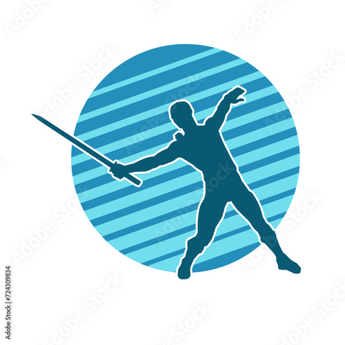 Silhouette of a male warrior in action pose with sword weapon. Silhouette of a man fighter carrying sword weapon.