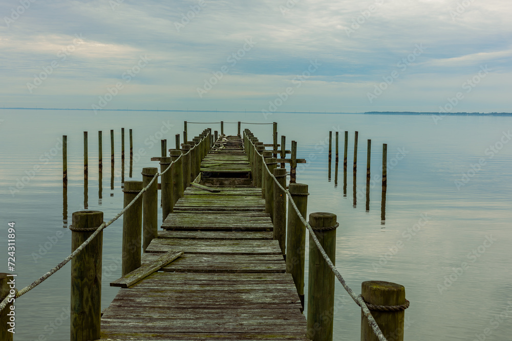 Storm Damaged Dock On Body of Water