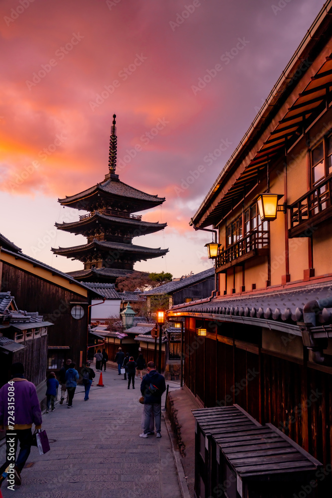 Yasaka Pagoda view and Hokan-ji Temple from Yasaka Dori street in Kyoto, Japan. Popular touristic street leading to Kyomizu Dera, Ninenzaka and Sennenzaka, In the evening, the sunset. Yasaka Pagoda view and Hokan-ji Temple from Yasaka Dori street in Kyoto, Japan. Popular touristic street leading to Kyomizu Dera, Ninenzaka and Sennenzaka, In the evening, the sunset.