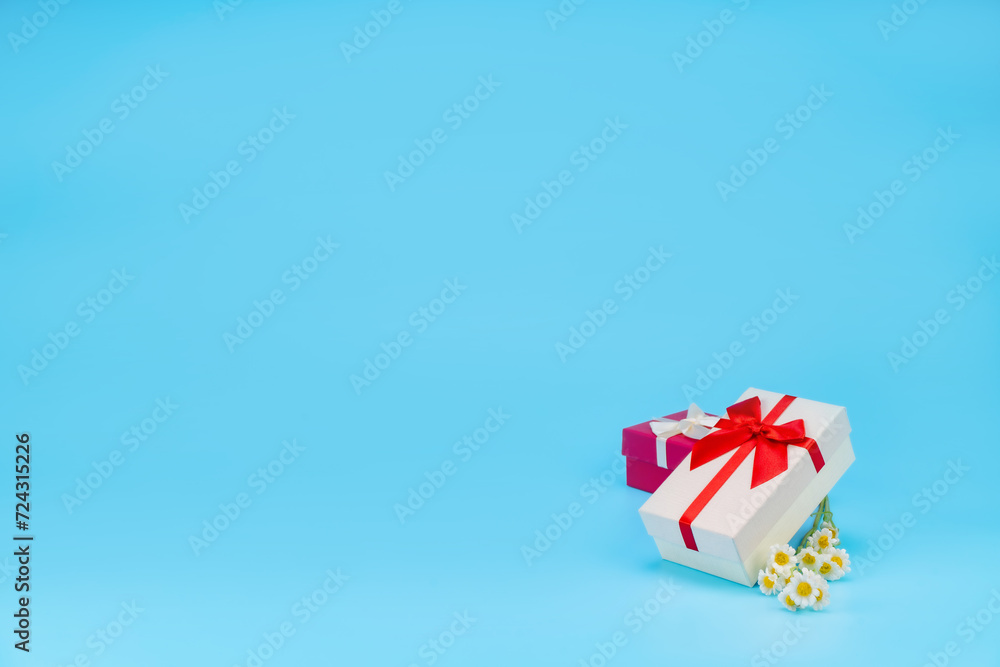 Happy birthday setup concept. Top view, Gift boxes in many colors Many boxes for birthday parties and celebrations, everyone is happy, and more on light blue background with space for text. Happy birthday setup concept. Top view, Gift boxes in many colors Many boxes for birthday parties and celebrations, everyone is happy, and more on light blue background with space for text.