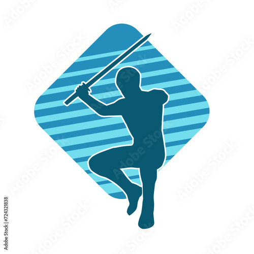Silhouette of a male warrior in action pose with sword weapon. Silhouette of a man fighter carrying sword weapon.