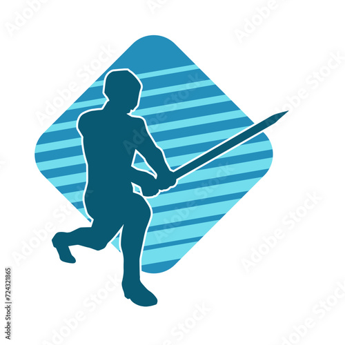 Silhouette of a male warrior in action pose with sword weapon. Silhouette of a man fighter carrying sword weapon.
