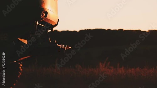 a harvester at sunset