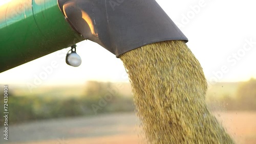 harvester unloading soybeans