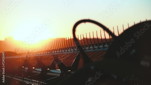 a harvester at sunset
