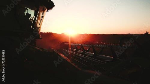 a harvester at sunset
