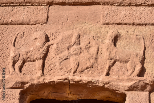 Frieze carved into the rock at the entrance of a house in the Hegra archaeological park in the city of Al Ula. photo