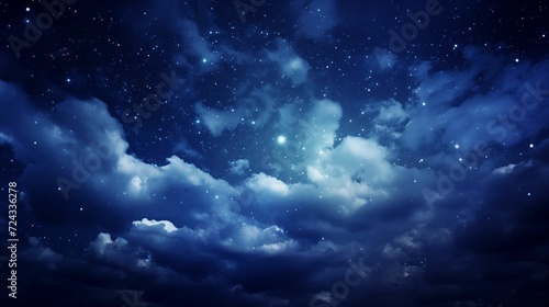 The night sky  clouds and countless sparkling stars.
