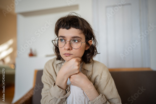 Apathetical teenager with indifferent glance, feeling melancholy, procrastination. Teen girl having problems at school, misunderstanding with parents. Puberty, negative emotional adolescence period
