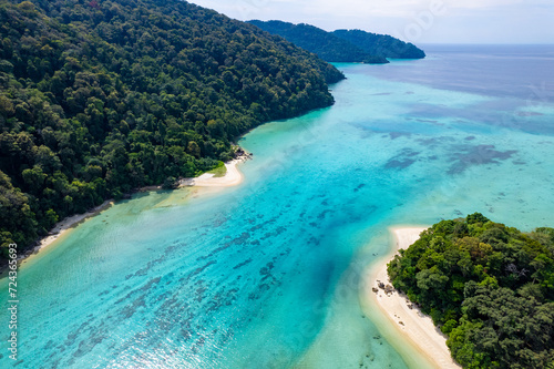Aerial view of Island in the Andaman Sea. natural blue sea Tropical seas of Thailand The beautiful scenery of the island is very impressive. 