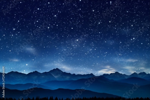 Night sky with stars and silhouettes of mountains