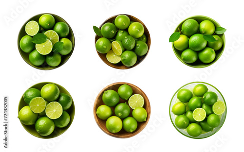 Collection bowl of whole and cut-in-half fresh limes isolated on a transparent background, top view