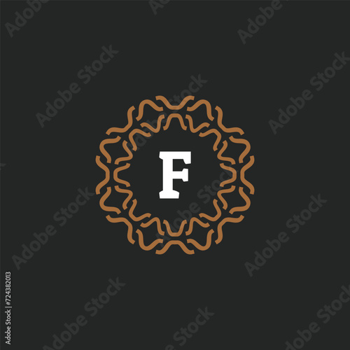 Initial letter F ornamental border circle frame logo