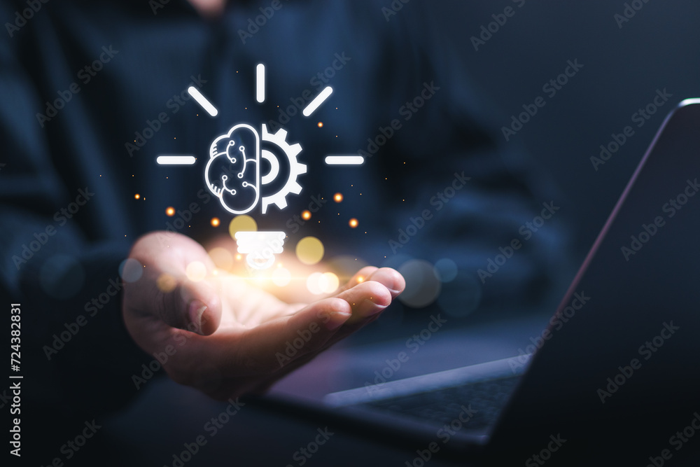 Innovation concept. Person use laptop with virtual light bulb icon for ...
