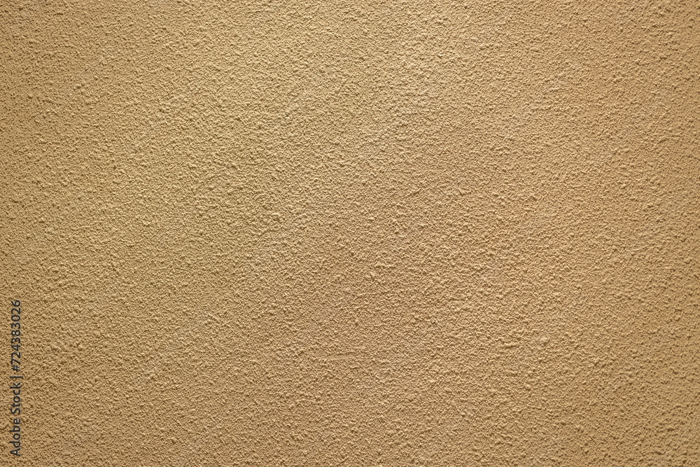 Sand wall brown color with fine rugged sand detail emboss exterior wall building decoration texture pattern background Sand wall brown color with fine rugged sand detail emboss exterior wall building decoration texture pattern background