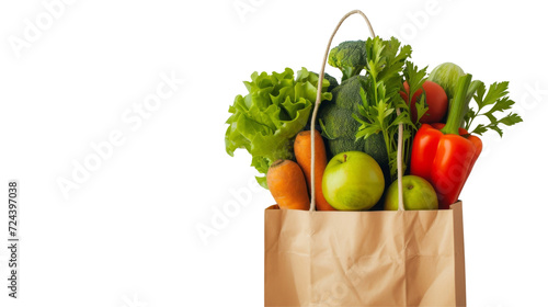 Fresh vegetables in a brown paper bag on a white background, zero waste concept