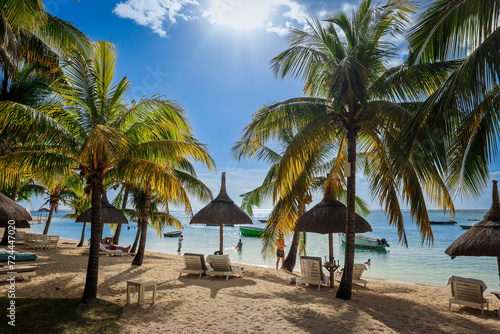 Sandy Beach With Palm Trees and Chairs in Mauritius