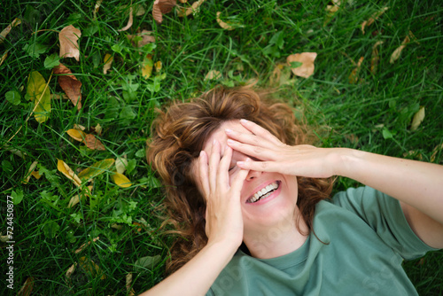 Face, smile and portrait of a woman happy in a park in summer for beauty, excited and confident in nature. garden and female person or model outdoor with freedom, happiness, style. High quality photo