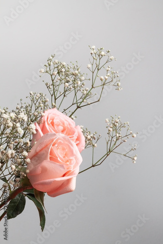 bouquet of flowers with roses on gray background