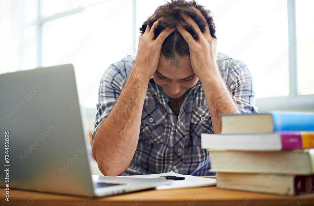 Student, headache and stress for education, college or e learning test, bad results or time management fail. Man with anxiety, depression and confused or frustrated for university research on laptop Student, headache and stress for education, college or e learning test, bad results or time management fail. Man with anxiety, depression and confused or frustrated for university research on laptop