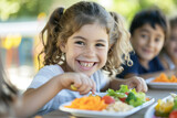 Happy and joyful children eating healthy food in the schoolyard