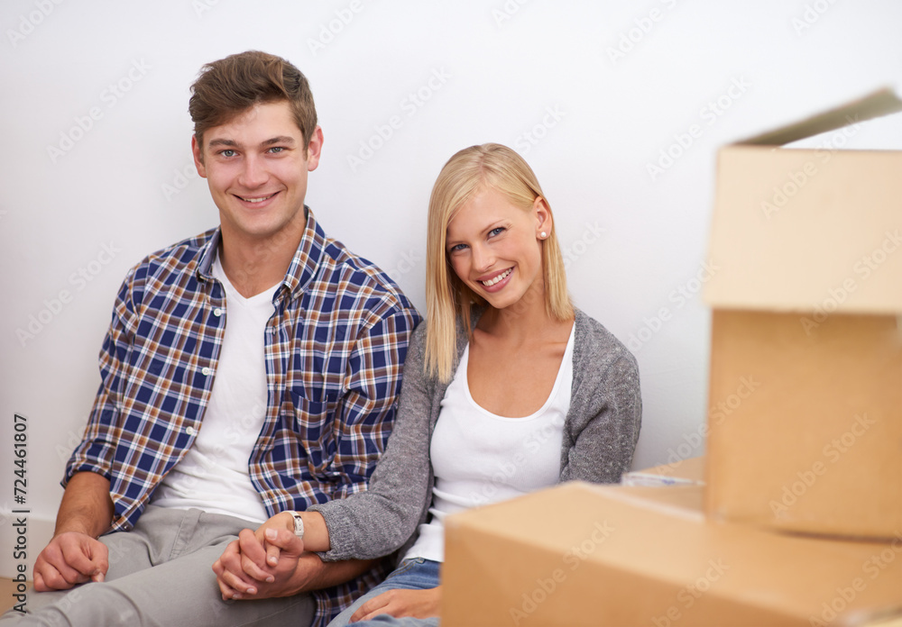 Couple, moving and new home, portrait with boxes for packing and real estate, happy holding hands and support. Property, investment and people smile with cardboard for relocation, mortgage or rent Couple, moving and new home, portrait with boxes for packing and real estate, happy holding hands and support. Property, investment and people smile with cardboard for relocation, mortgage or rent