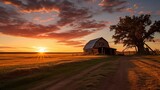 Rustic farm with granary and golden sky at sunset