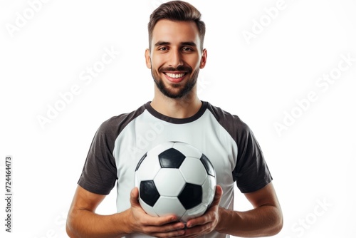 Enthusiastic Soccer Player Proudly Holds The Ball, Isolated On White Background