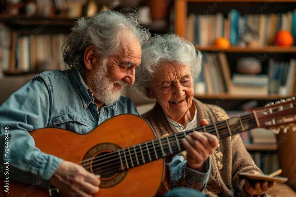 A Portrait of an elderly couple enjoying playing the guitar in their own home. They have a smiling and happy face. A Portrait of an elderly couple enjoying playing the guitar in their own home. They have a smiling and happy face.
